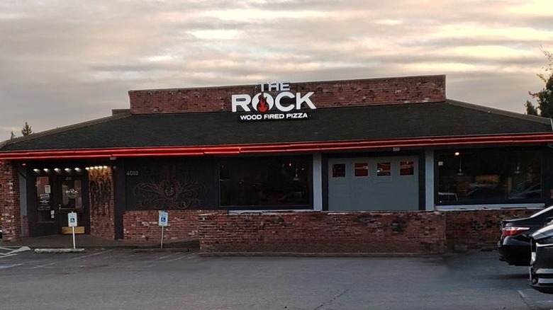 The Rock Wood Fired Pizza storefront and logo