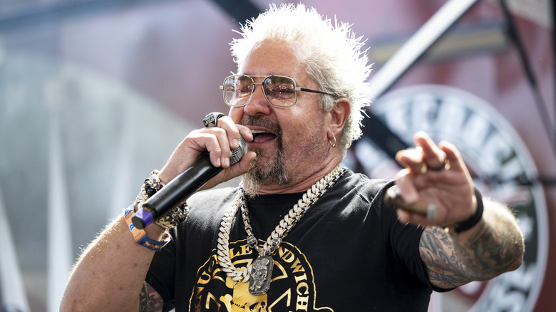 Gui Fieri at Stagecoach Festival at Empire Polo Club holding a microphone