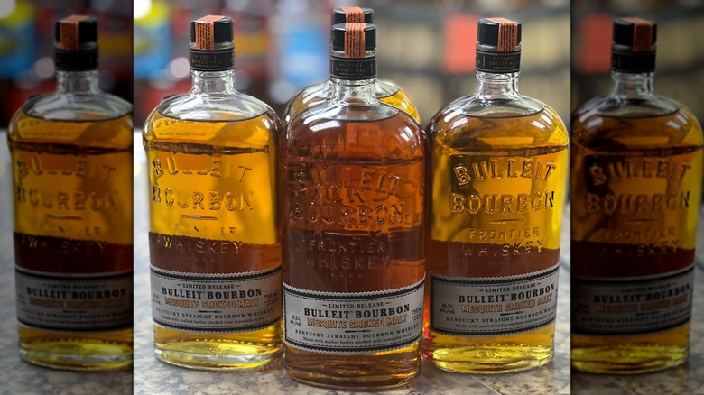 Four bottles of Bulleit Mesquite Smoked Malt Bourbon