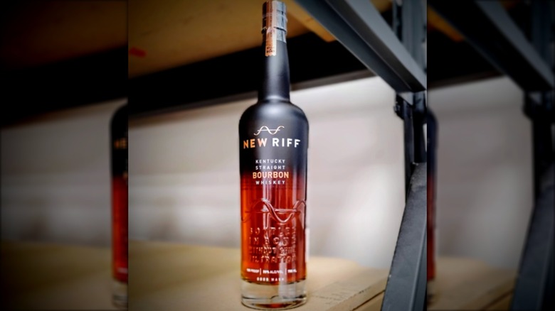 Bottle of New Riff Bottled in Bond on wood and steel shelf
