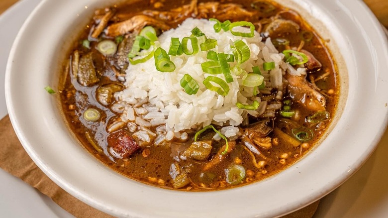 Bowl of gumbo and rice in a white bowl at Cochon restaurant in New Orleans