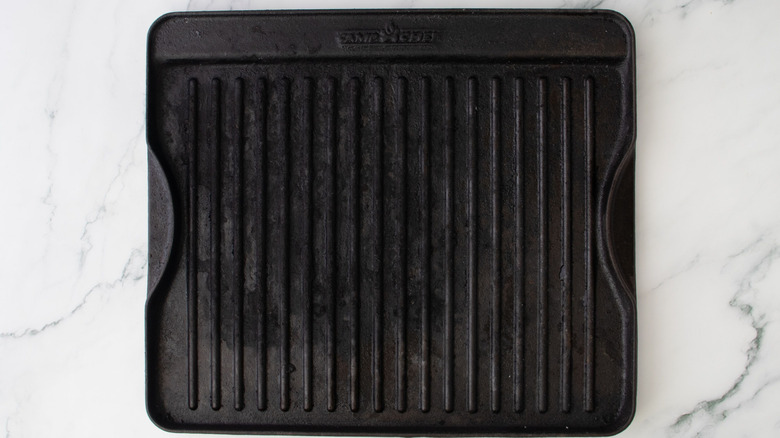 Clean grill pan sitting on marble countertop