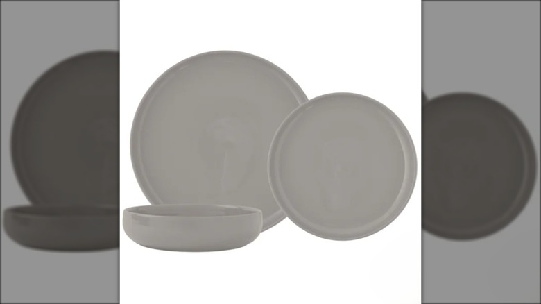 Dinnerware set with two gray plates in different sizes and shallow bowl.