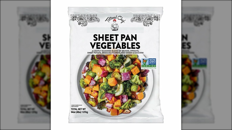 Bag of chopped frozen vegetables against white background.