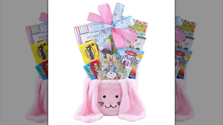 Pink bunny Easter basket with assorted candy and snacks inside