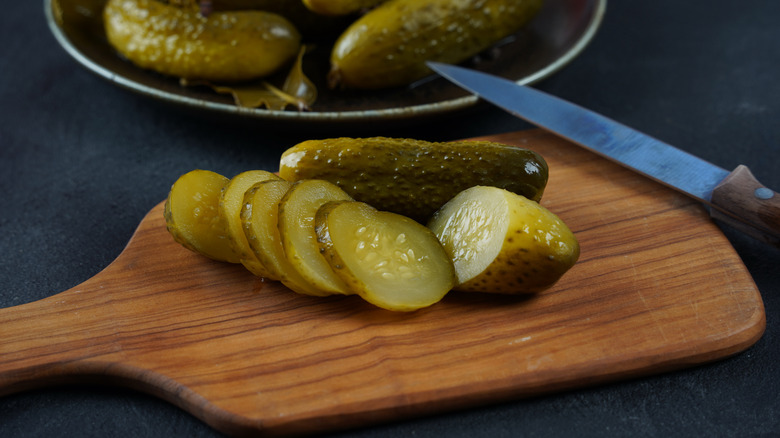 Slices of pickles on a cutting board