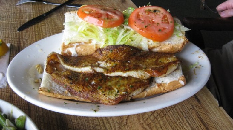 Felix's Fish Camp grilled flounder po boy sandwich on plate