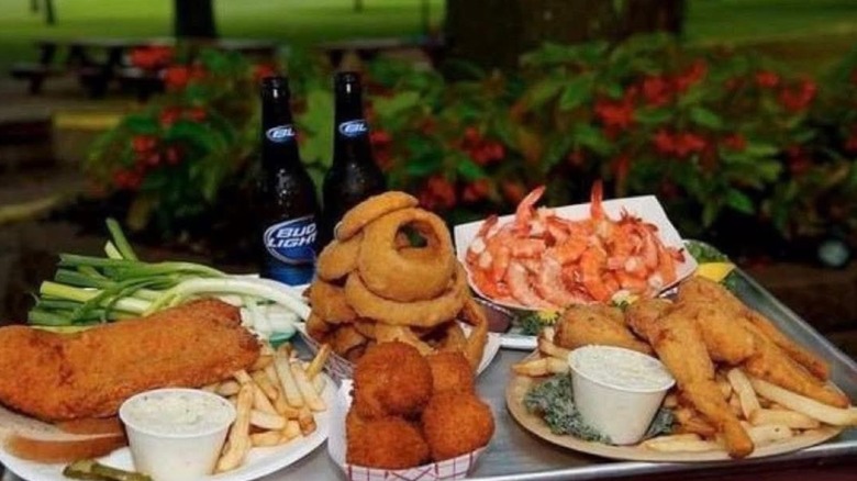 Seafood platter with fish sandwich onion rings and shrimp