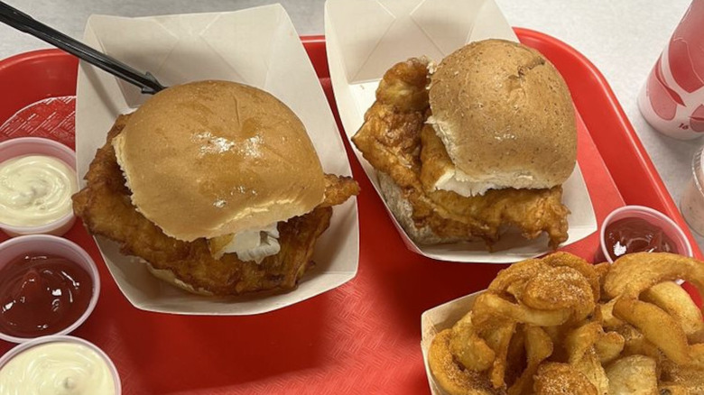 Two fish sandwiches on red tray with fries from Wholey's Fish market in Pennsylvania
