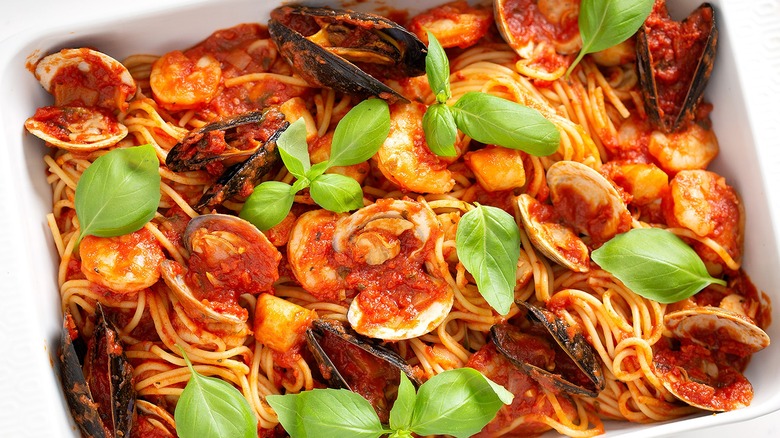 dish of cooked frutti di mare in tomato sauce with pasta