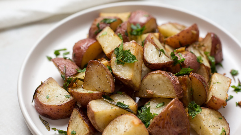 roasted potatoes on white plate