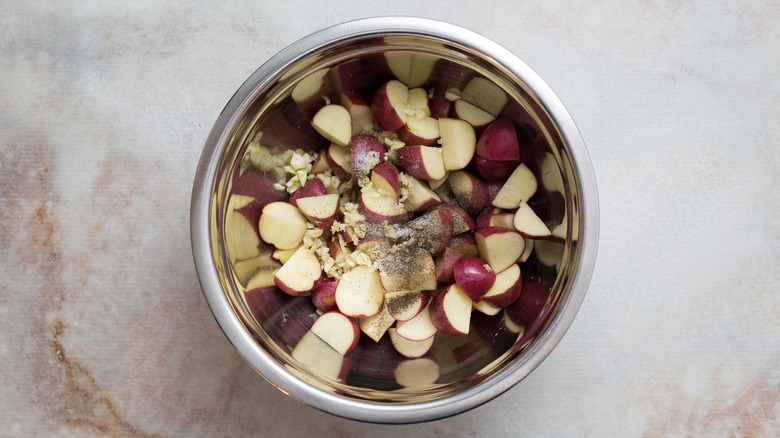 raw potatoes in mixing bowl
