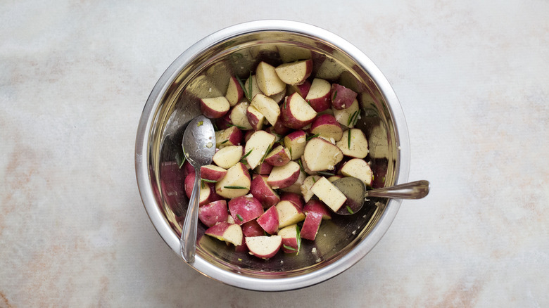 raw potatoes in mixing bowl
