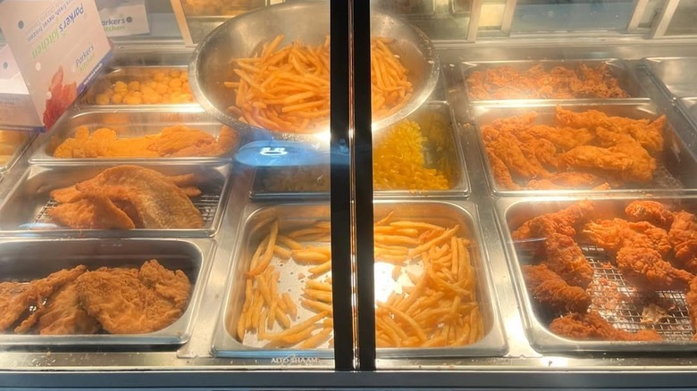 Fried chicken and fresh french fries in a Parker's display case