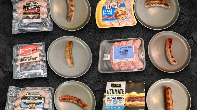 Various cooked bratwursts on plates with packages