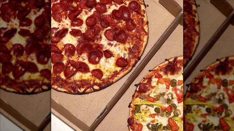 Close up of Plank's pizza in cardboard boxes