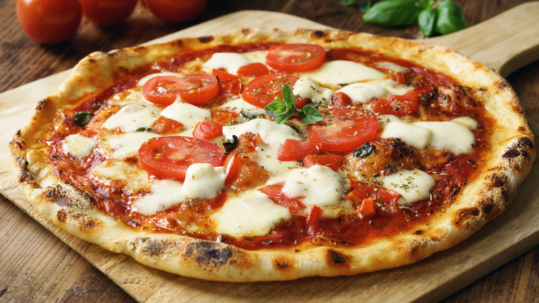 neapolitan style pizza with tomatoes and mozzarella
