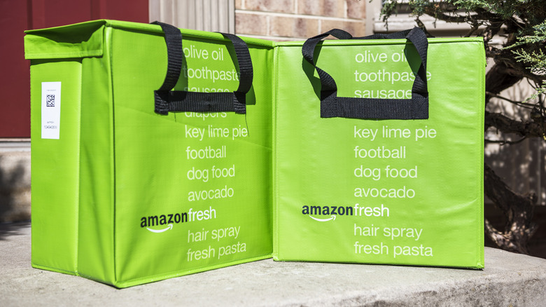 Green Amazon Fresh bags on front porch