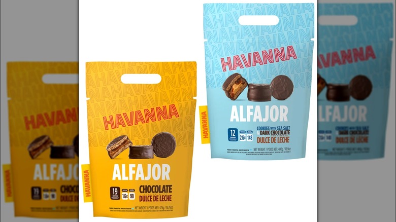 Two bags of chocolate-coated cookie sandwiches with filling.