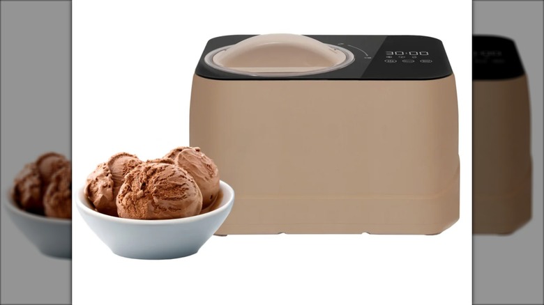 ice cream maker next to bowl of chocolate ice cream