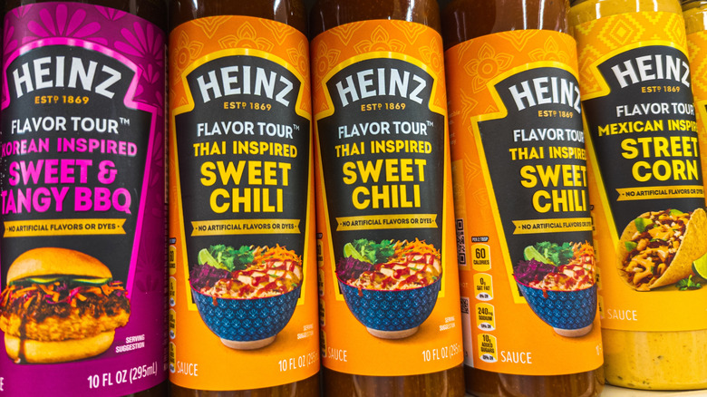 Thai sweet chili sauce bottles on grocery store shelf