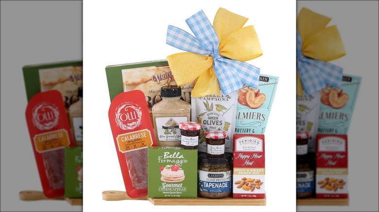 Gift pack with spreads, cured meats, condiments, and other charcuterie items.