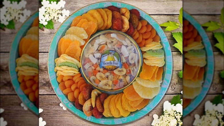 Assorted dried fruits in round gift tray.