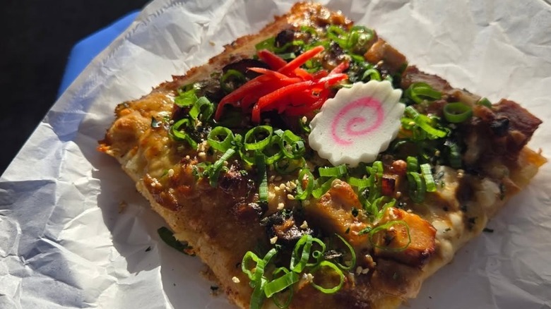 Outta Sight slice with colorful toppings