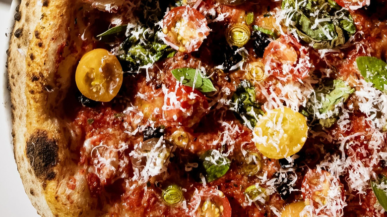 pizza with tomatoes and cheese