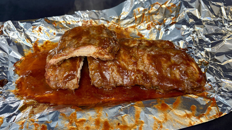 Cooked Curly's ribs on aluminum foil