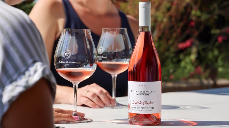 Bottle and glasses of Willamette Valley Vineyards Whole Cluster Rosé of Pinot Noir