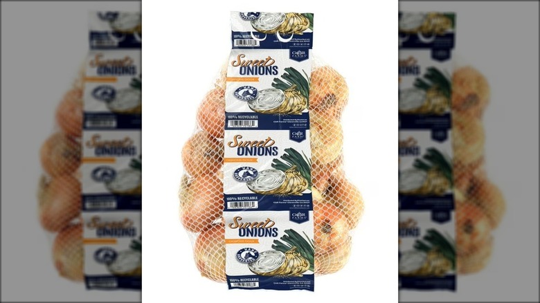 Mesh bag with paper label containing sweet onions.