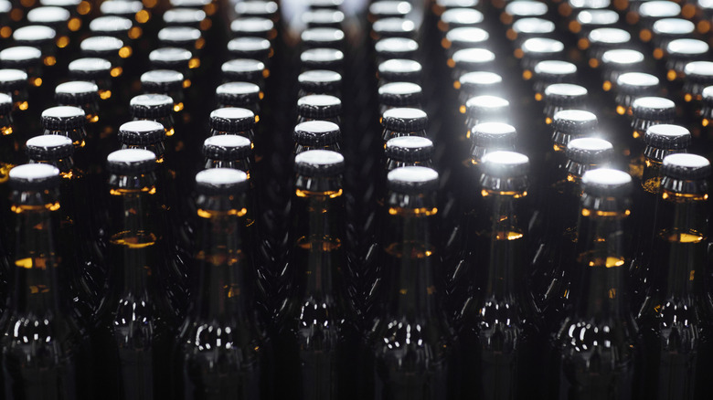 Rows of unlabeled brown beer bottles