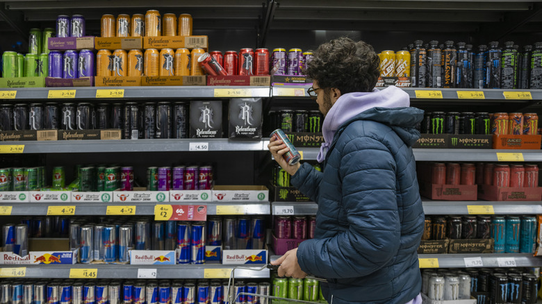 Grocery store shelf with a variety of energy drinks