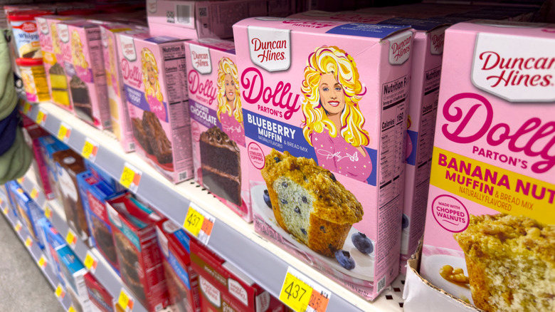 Boxes of Dolly Parton baking mixes on a store shelf