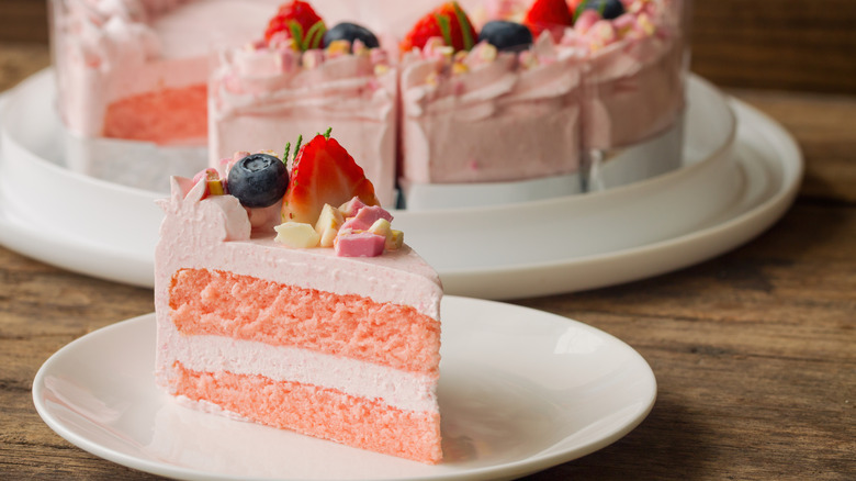 Strawberry cake slice on a white plate