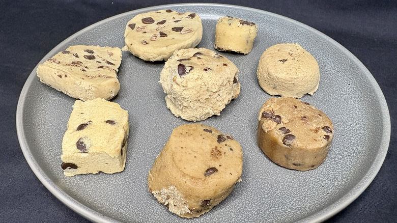 eight balls of raw cookie dough on plate
