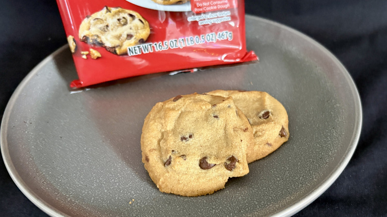 two cookies on plate in front of red package