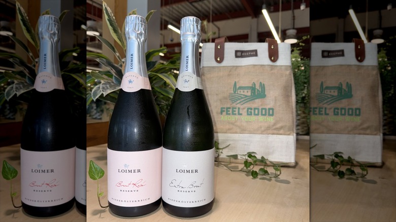 Bottle of Loimer Brut Rosé next to Loimer Extra Brut
