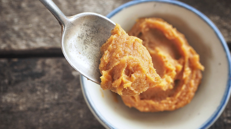 Miso paste being spooned