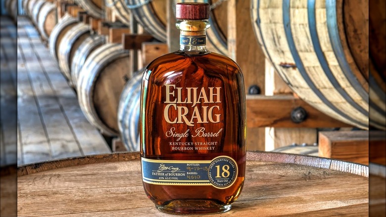 Elijah Craig 18-year-old on barrel with barrels in background