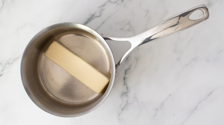 Stick of butter in saucepan