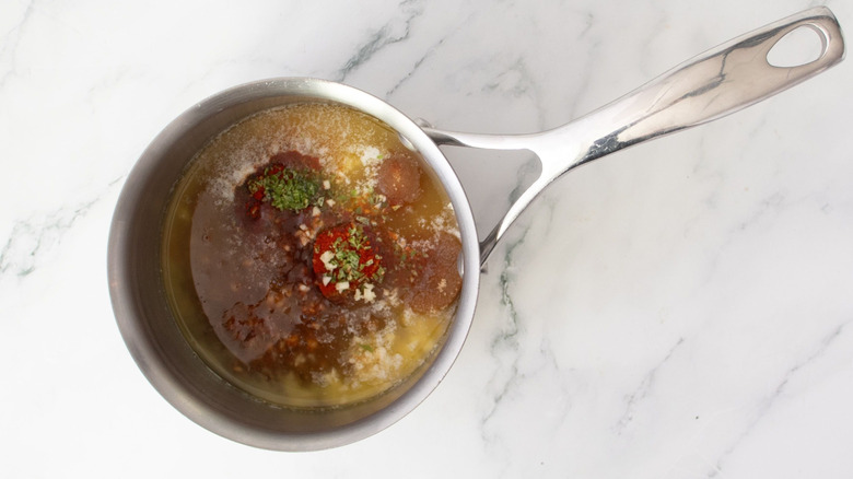 Various wing sauce ingredients in saucepan