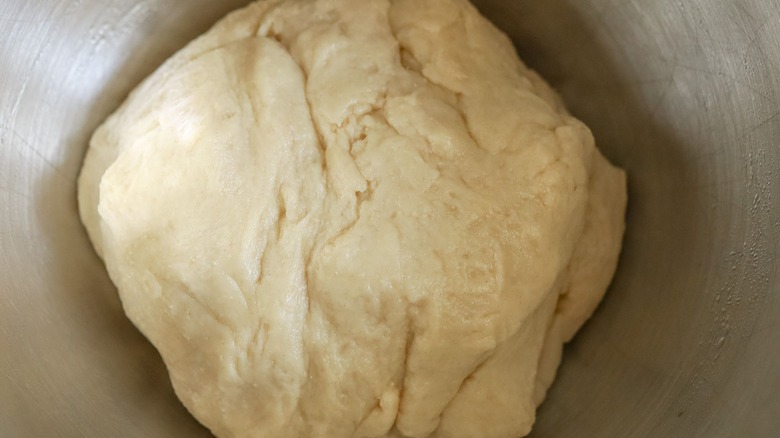 Risen dough in mixing bowl