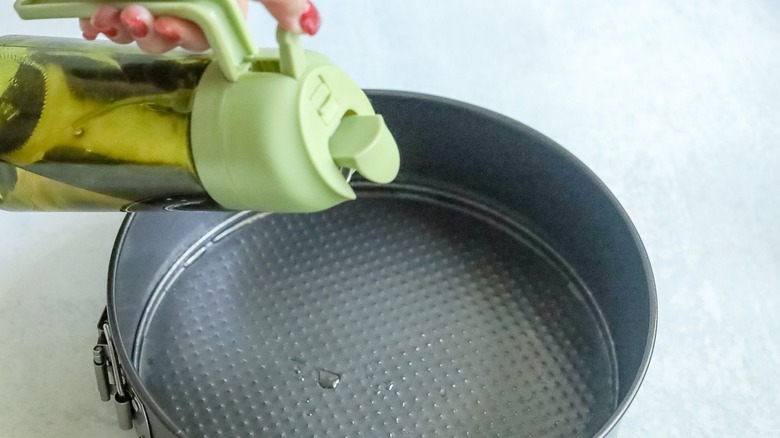 Pouring oil into springform pan