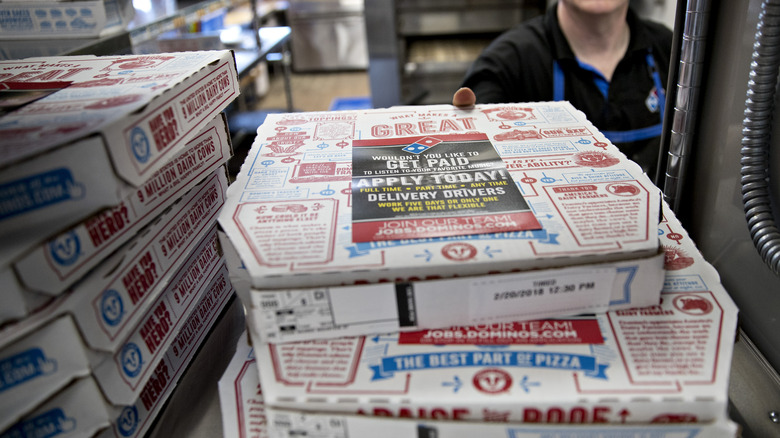 Stack of Domino's pizza boxes
