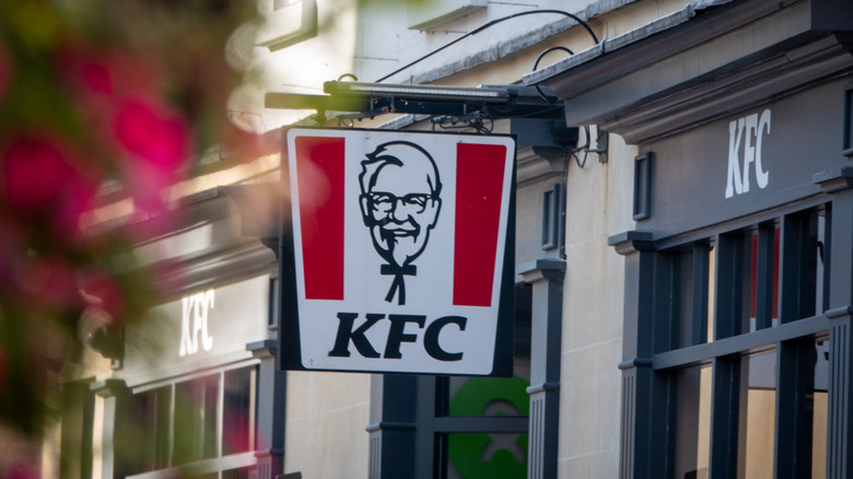 A KFC sign outside a quaint shop in the United Kingdom