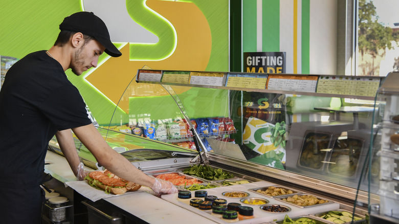 subway employee making sub