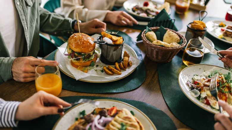 diners eating restaurant orders