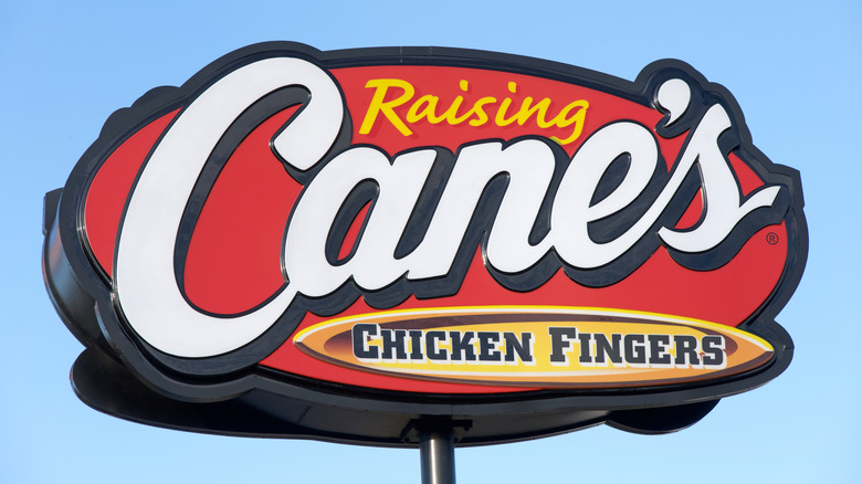 Raising Cane's sign with blue sky